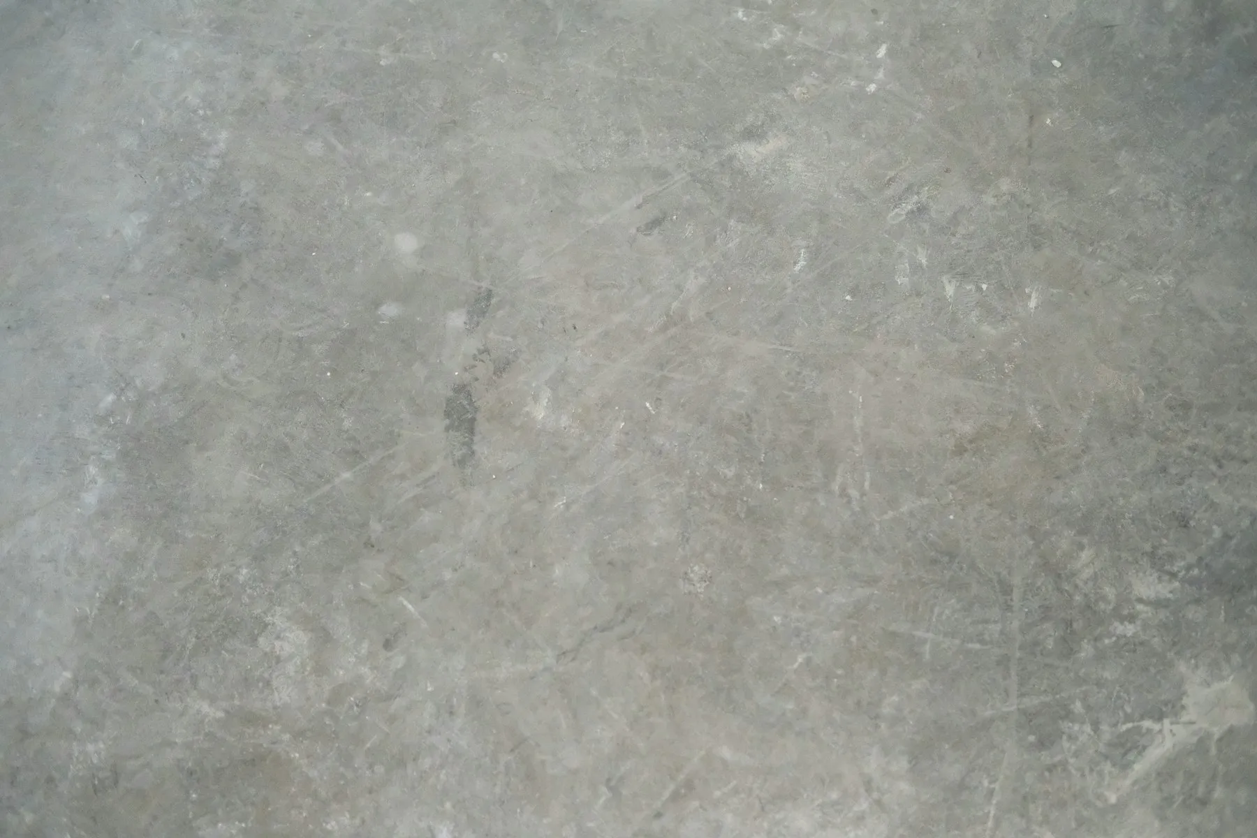 A close-up view of a gray concrete surface