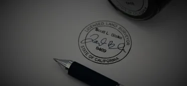 A pen resting on a printed standards document