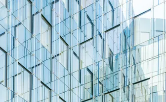 A glass curtain-wall building facade