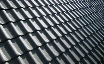 A close-up of a grey tiled roof