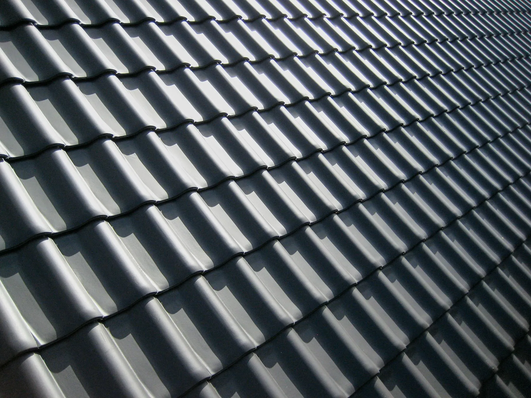 A close-up of a grey tiled roof